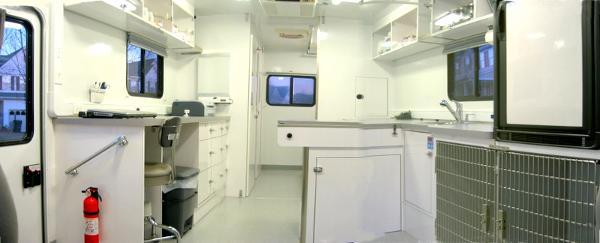 'exam room' with a view into the surgery room in the back.  It's fully stocked with everything you would find in a permanent clinic!